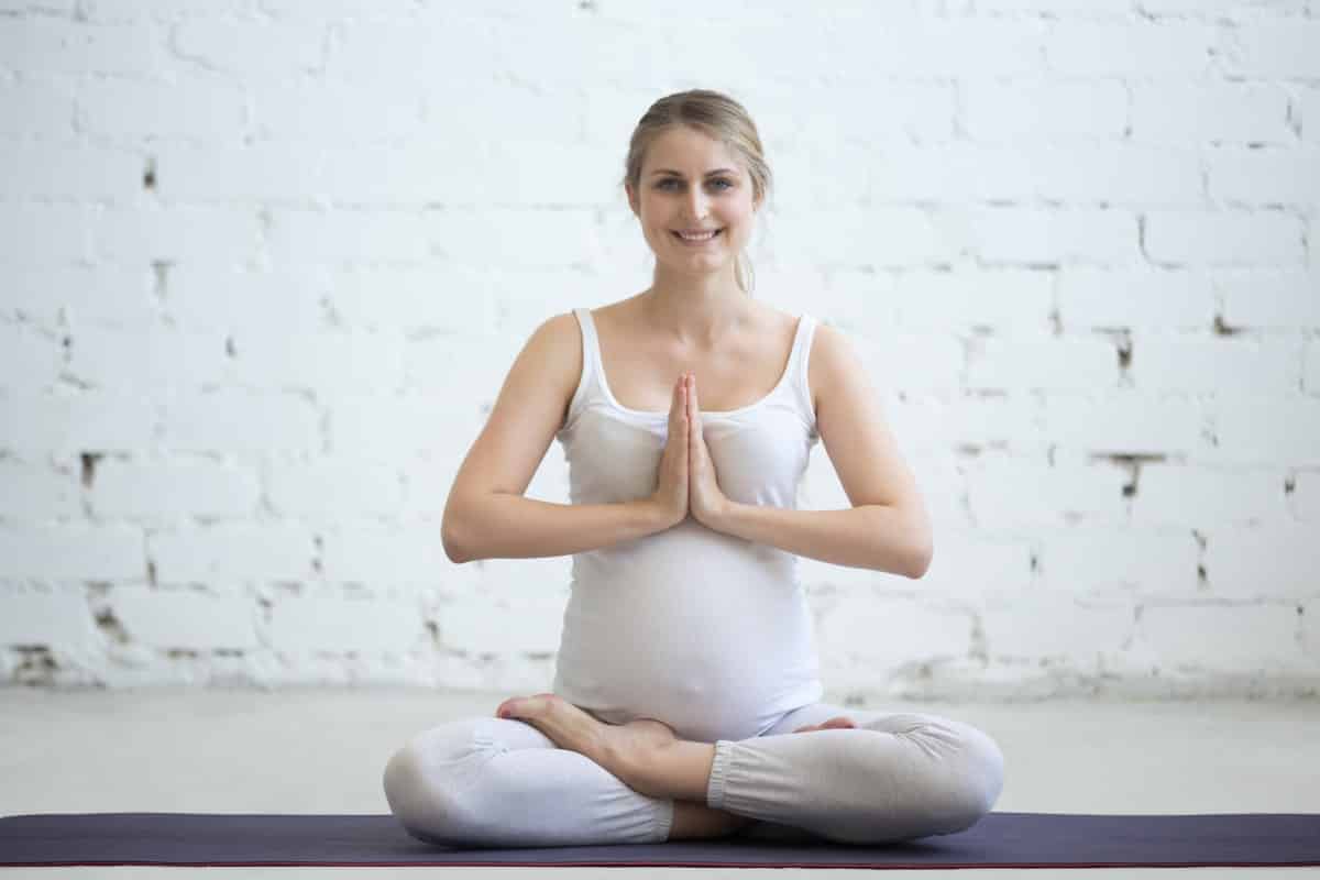 pregnant-young-woman-sitting-prenatal-yoga-prayer-position (1)